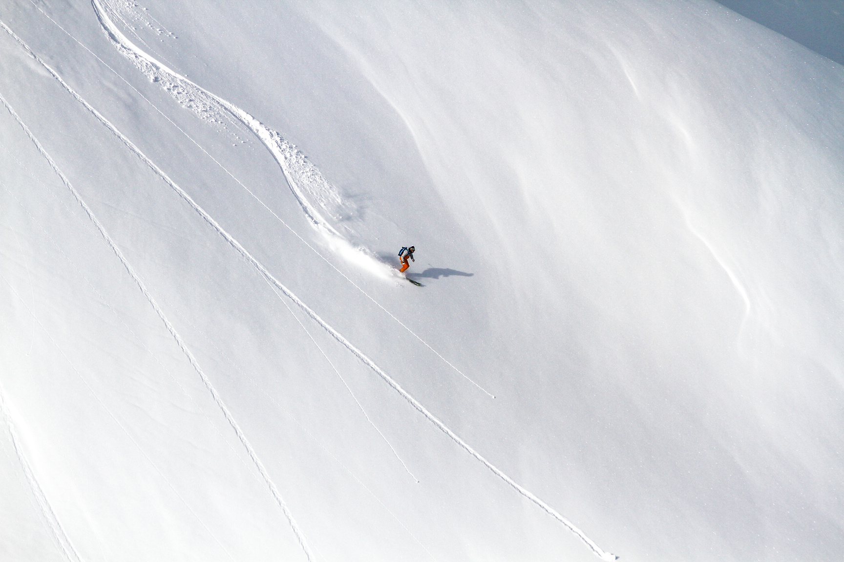 A Person Skiing on Snow Covered Mountain